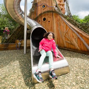 Girl coming out of slide